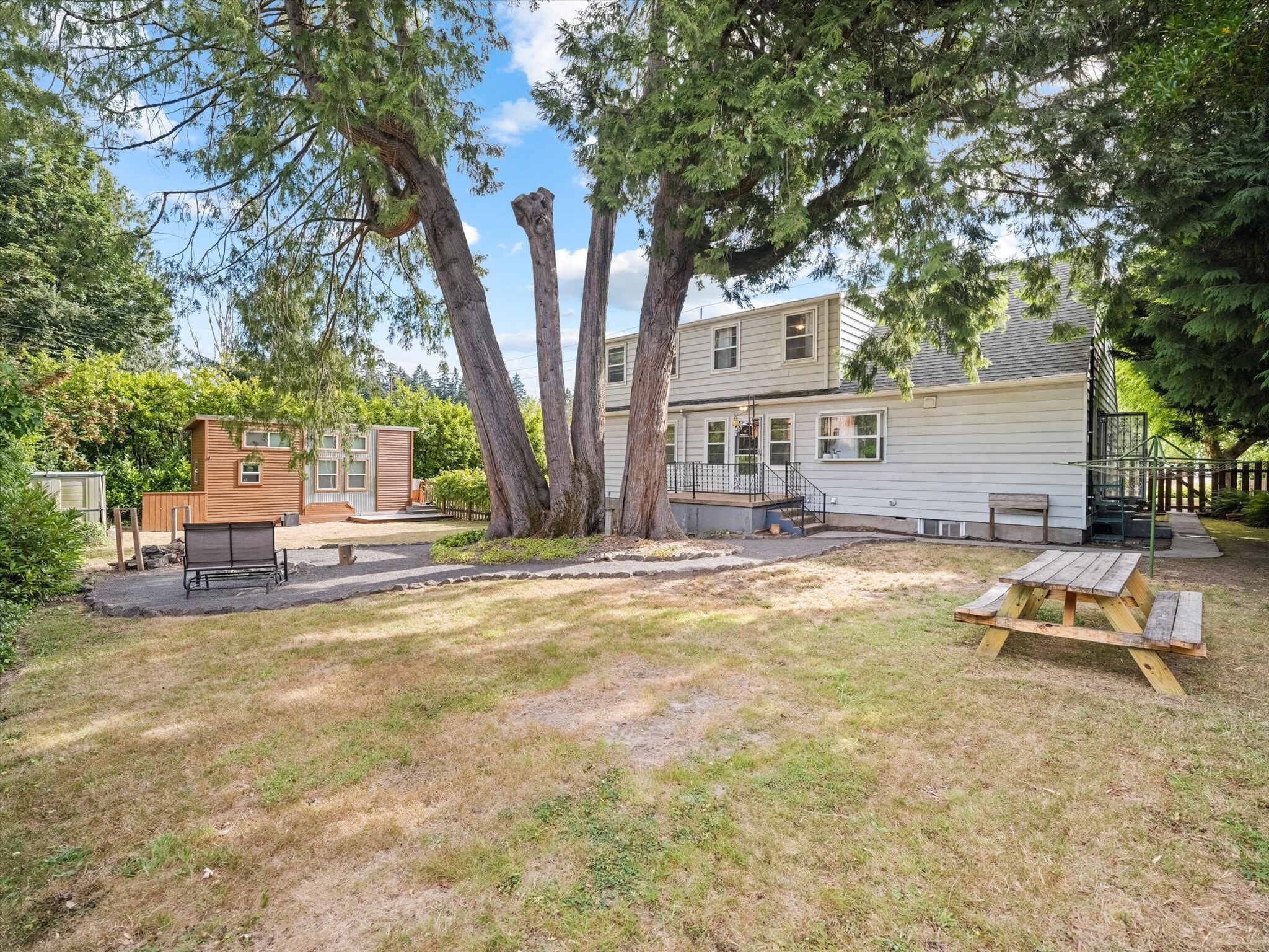 Three units share a spacious backyard. - 9835 SW 80th Ave
