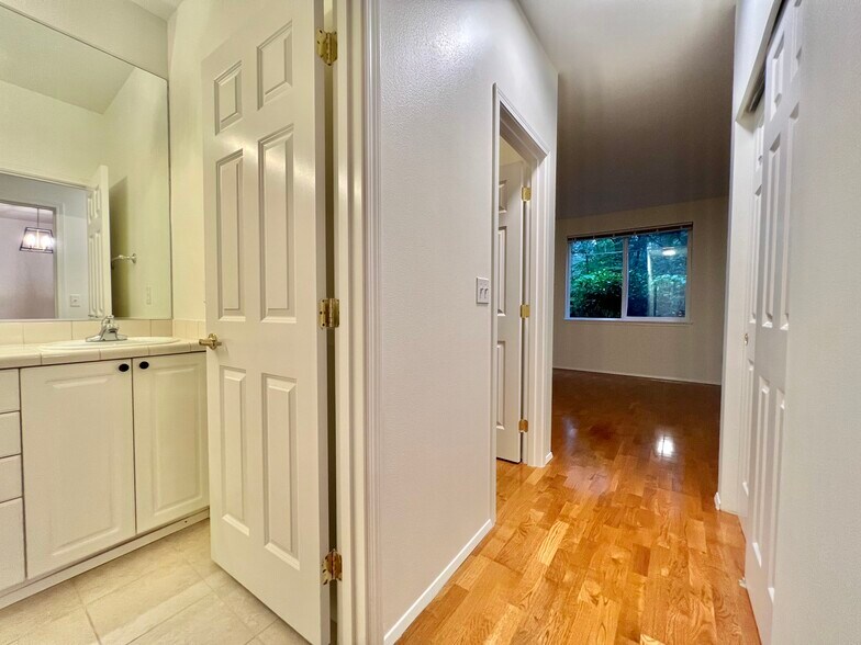Large primary bedroom has its own bathroom, and two large closets, one of which is a walk-in closet - 12712 Admiralty Way