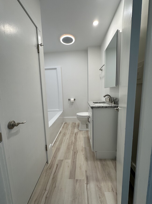 Fully renovated bathroom with new toilet, Bluetooth exhaust fan, granite vanity, medicine cabinet - 12 Tiffany St