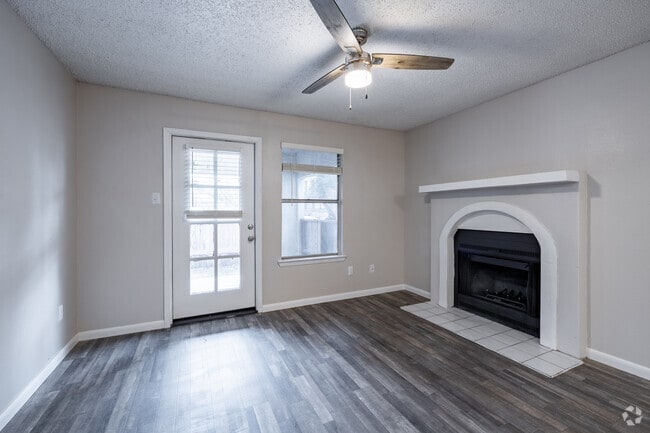 Two bedroom unit living area and fireplace. - Villas De Toscana