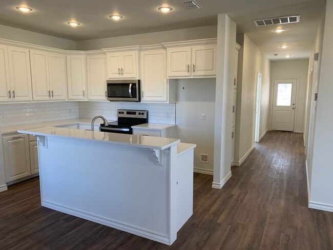 Building Photo - Beautiful brand new!! All the bells and wh...