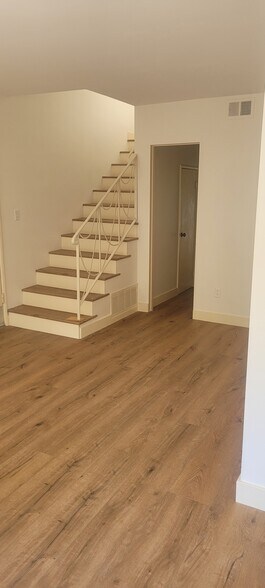 Stairs from living dining area leading 2 2 bedrooms and full bath - 8934 Wonderland Ave