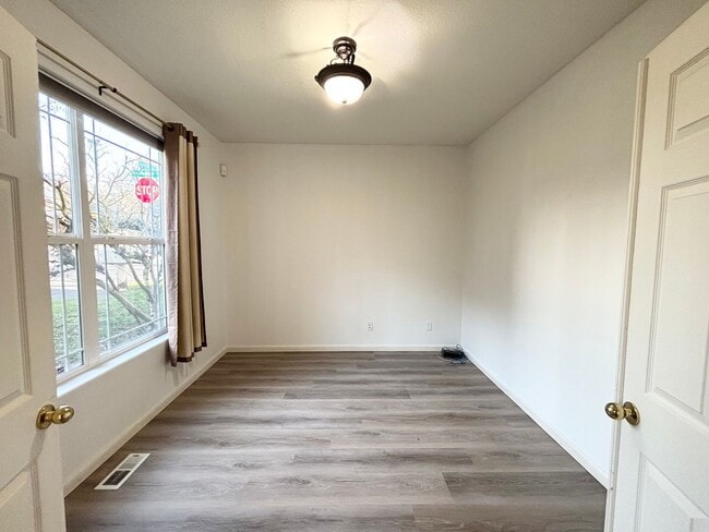 Building Photo - Stunning Remodeled Home with Office, A/C, Fenced Yard & Flexible Living Space!