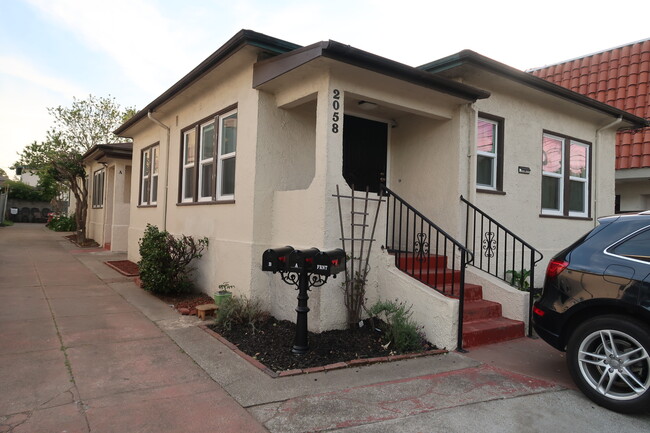 Property entrance/front cottage viewed from sidewalk - 2058 Buena Vista Ave