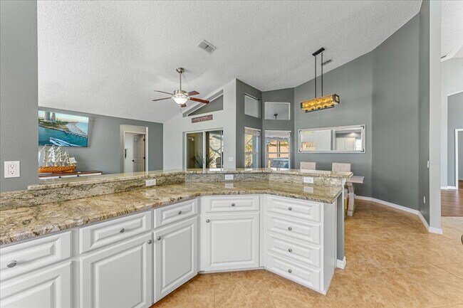 Building Photo - A vibrant 2-bedroom, 2-bathroom tropical retreat designed for both high-energy entertaining and l...