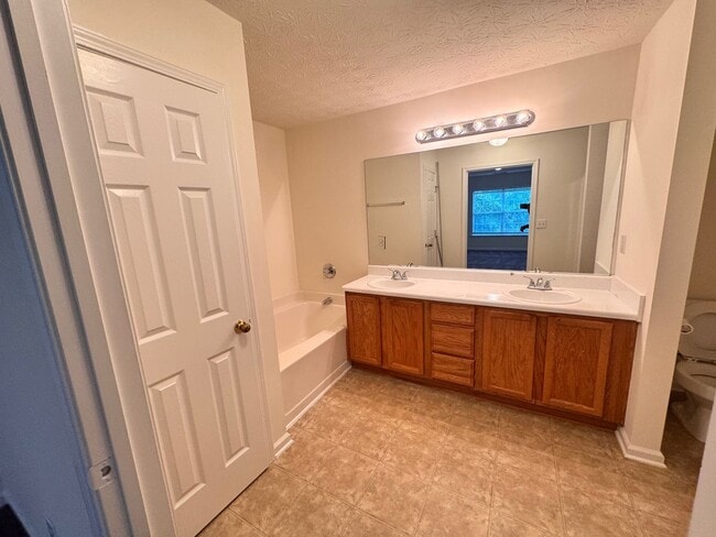 Building Photo - Peaceful 2-Story Townhome - Soothing sound...