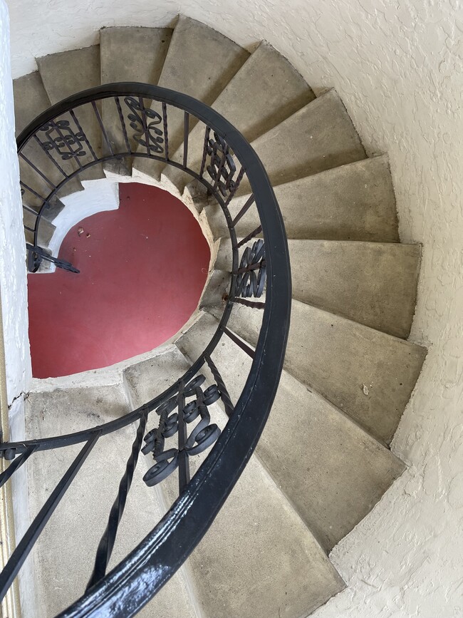 Spiral staircase to upper apartment - 6723 Pickering Ave