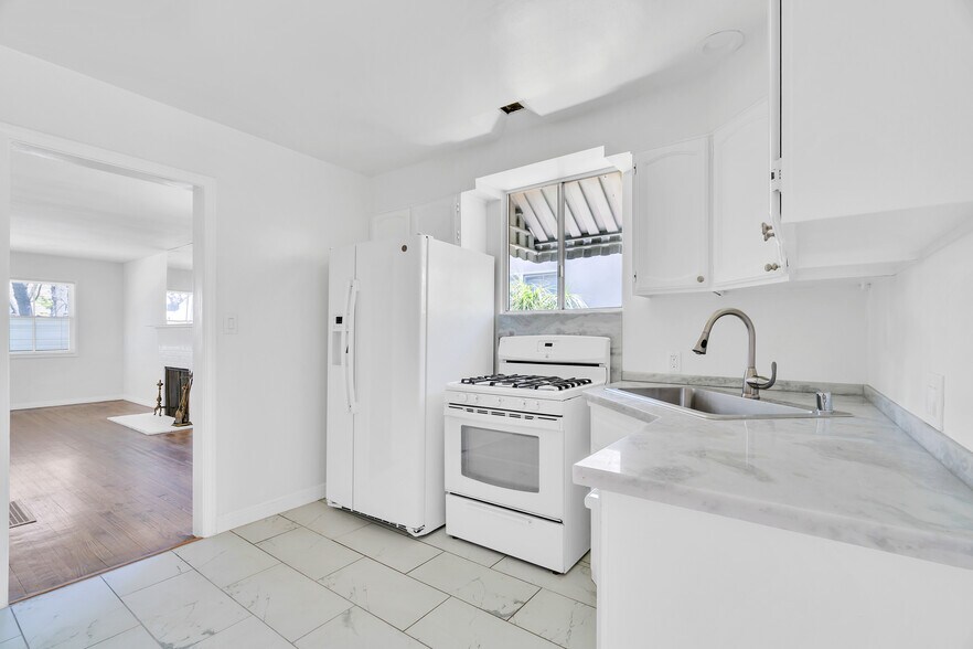 new Italian granite counter tops, new faucet and garbage disposal - 2935 Westwood Blvd