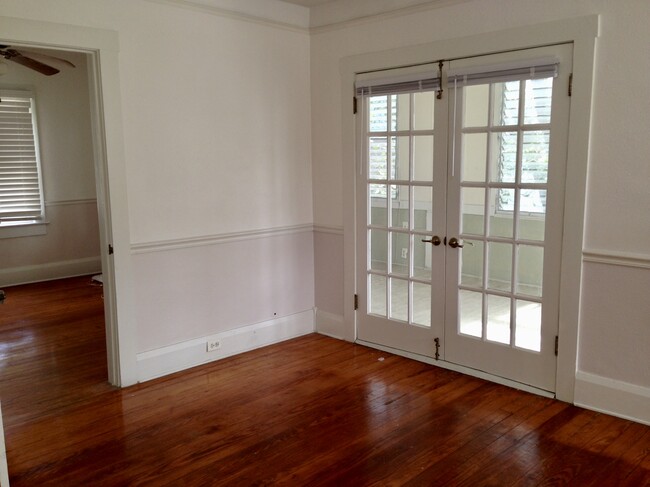 French doors in living room open to a spacious semi enclosed balcony - 720 W Hancock St