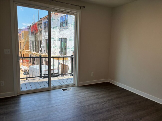 Building Photo - Pristine, move-in ready Townhome located i...