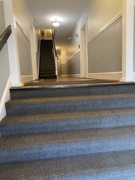 Carpeted stairway with wood floors - 1630 Monument Ave