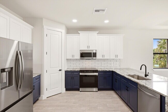 Building Photo - New 3/2 Pool Home for Rent on Canal, Fenced Yard, Pets Welcome. Your Dog Approves of This Backyard