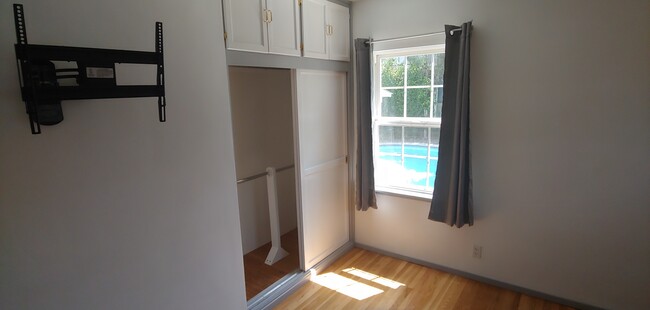 Downstairs Bedroom 2 closet and window - 7130 Stansbury Ave