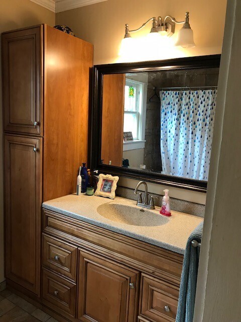 beautiful bath with linen closet and tile floor - 210 E Vermilya Ave