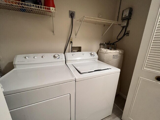 Building Photo - Two-story condominium, featuring 2 bedrooms and 2 1/2 bathrooms