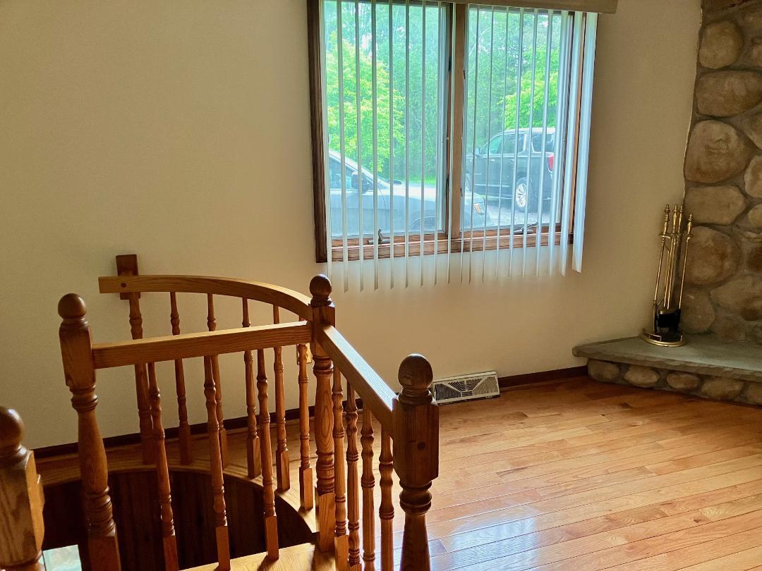 Spiral steps lead down to the lower level - 6878 Nickis Ln
