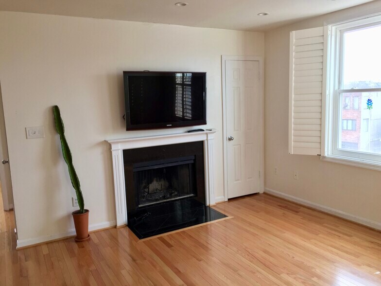 Wood burning fireplace and coat closet on the right - 730 11th St NE