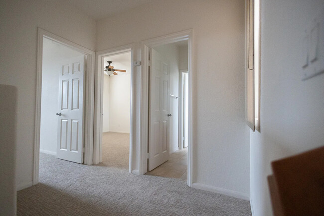 upstairs landing with doors to bedrooms 2 and 3 plus full bath - 948 Bolex Way