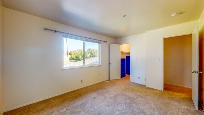 Building Photo - 2 story 2 bedroom 1 bath condo with covered parking, private storage and community pool!