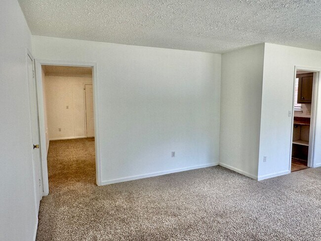 Building Photo - Cozy Meets Spacious: 4BR/2BA with Bonus Den & Patio