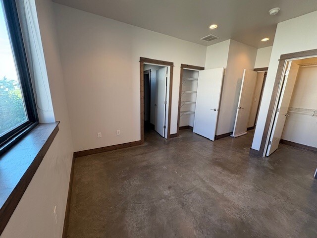 bedroom with bathroom to the left, small closet next to it and walk incloset to right - 49 Intrepid Dr