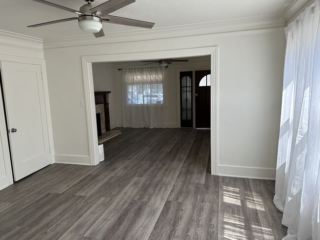 Large living room windows, ceiling fans, and closet - 5027 2nd Ave