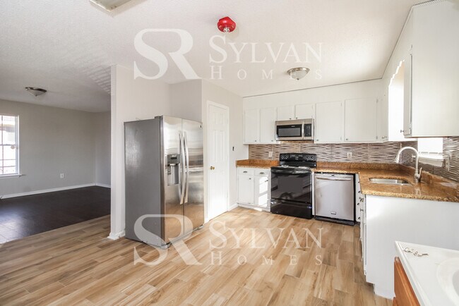 Building Photo - The living is easy in this 3 bedroom, 2.5 bathroom home