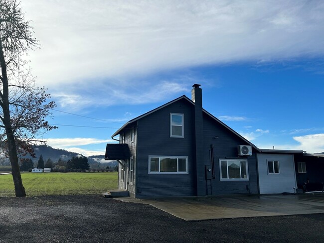 Building Photo - Updated 4 Bedroom House With Country Setting