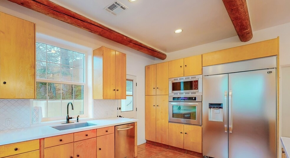 Kitchen built-ins and door to north patio - 25648 Timpangos Dr