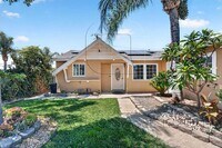 Building Photo - Charming 4 Bedroom Home with Private Yard & Garage Parking