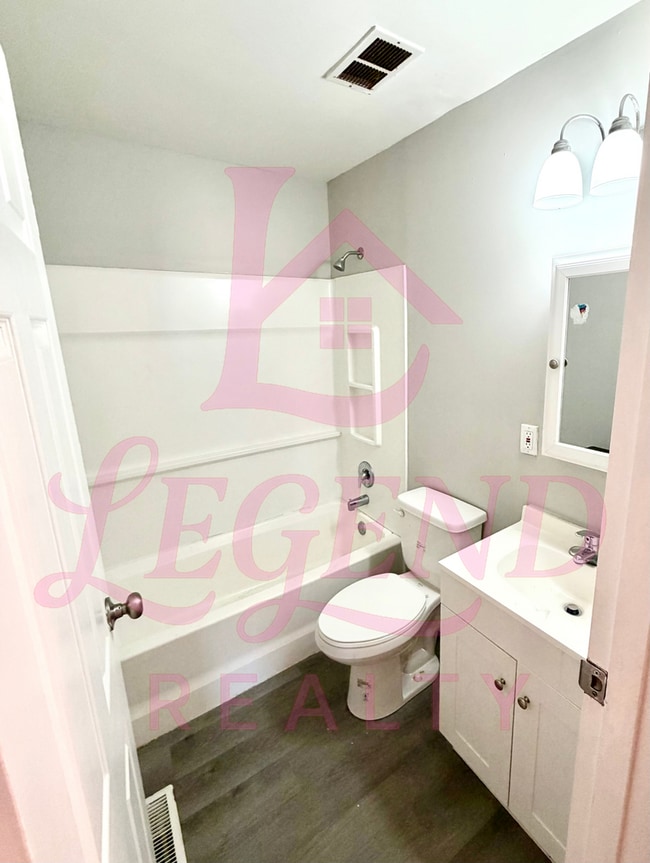 Building Photo - Spacious 4-Bedroom Home with Private Primary Suite & Hardwood Floors!