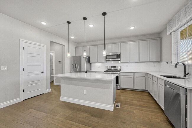 Building Photo - Former Model Home - Superb townhome in great location!