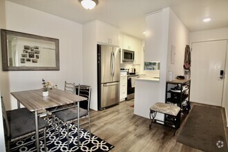 Building Photo - Stunning Two-Bedroom Condo in Prime West S...