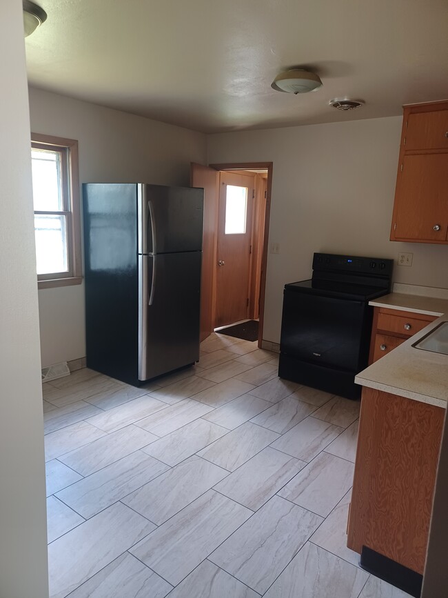 Building Photo - 211 W. Decorah Rd.