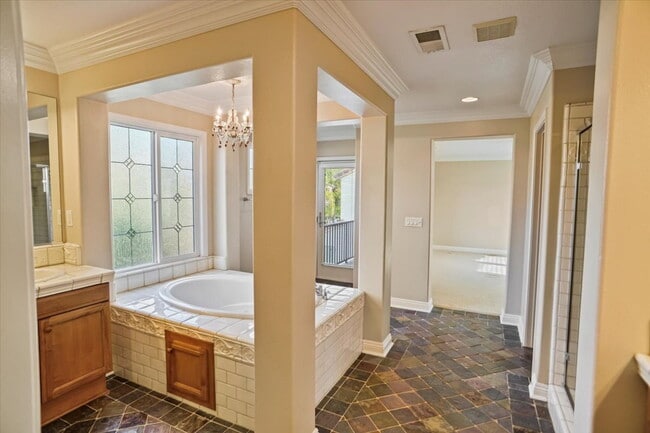 Building Photo - "Spacious 4-Bedroom Retreat with Cozy Fire...