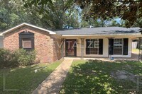 Building Photo - Brick Home with Carport