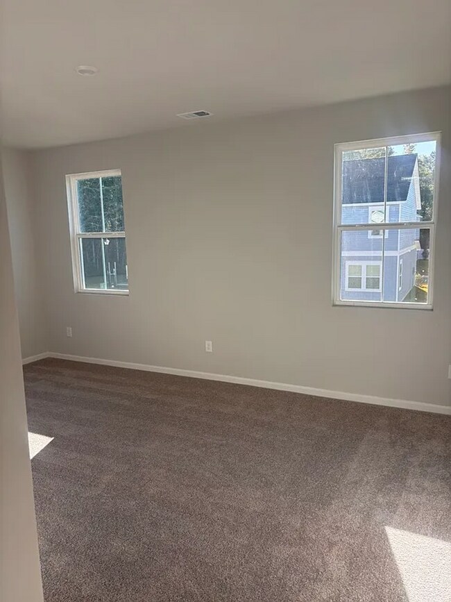 Building Photo - 4BR SFR • Open Layout • Patio • Garage Parking - 29566