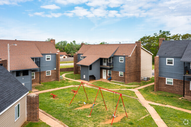 Front View with Playground - Pine Manor Apartments