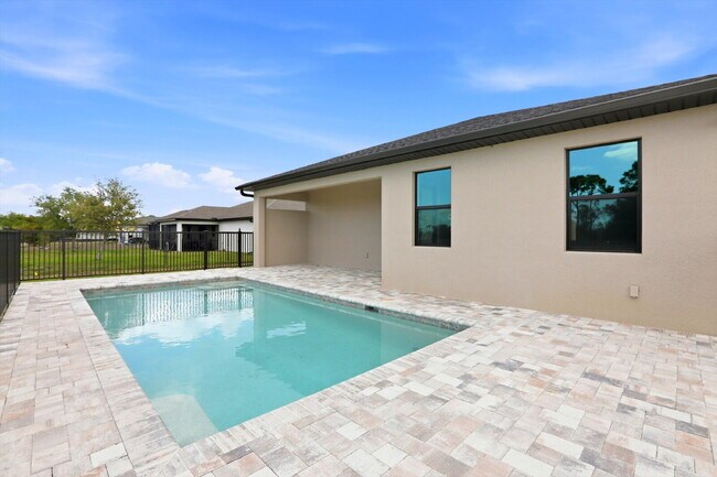 Building Photo - New Construction 3/2 Pool Home on Canal, $2,699, NW Cape Coral. The Only Thing Used Here Is the W...