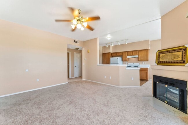 Building Photo - Bright & Stylish Condo with Fireplace and Private Balcony in a Resort-Style Community!