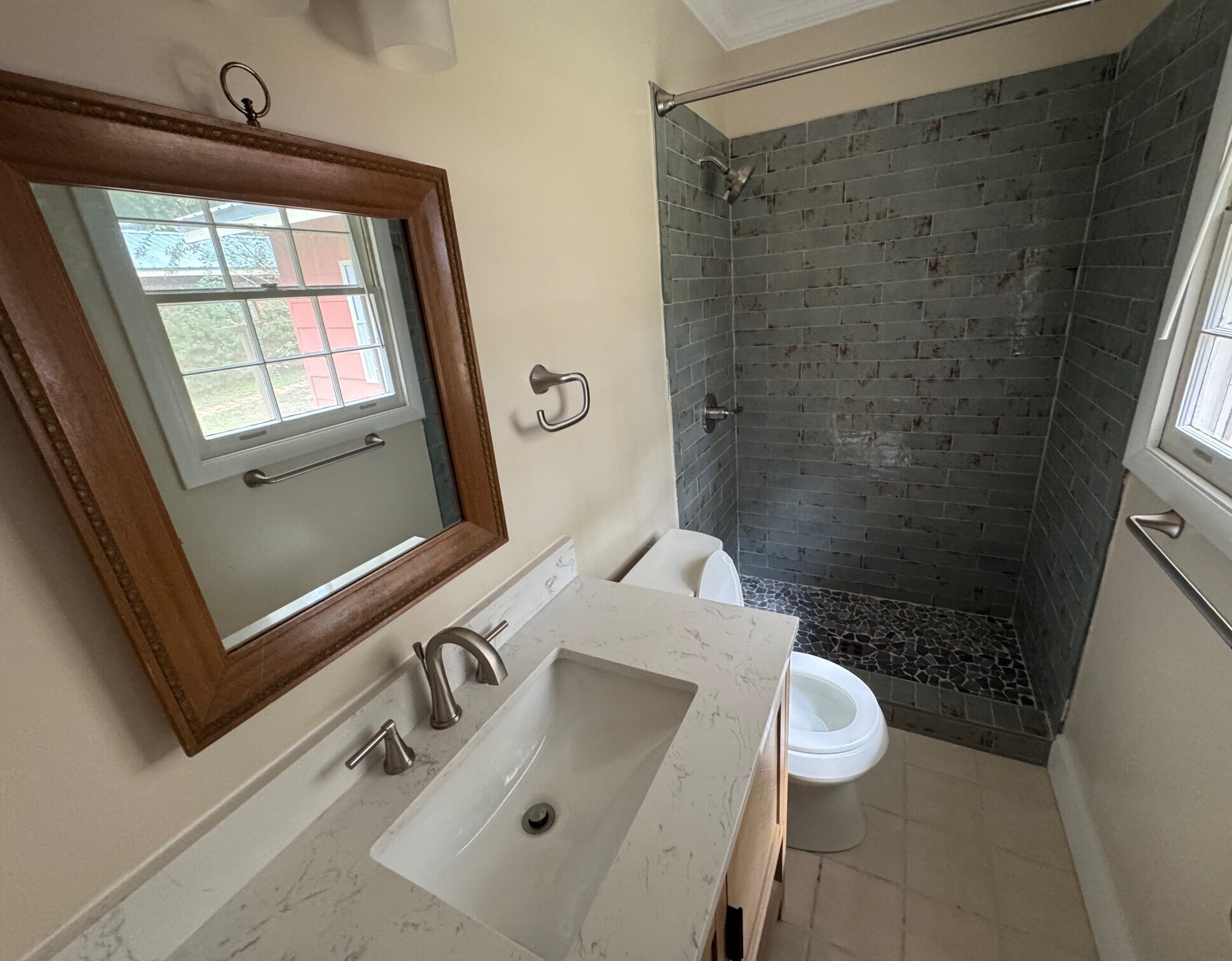Bathroom 2 - all new tile surround, toilet, vanity, hardware and lighting - 406 Rosa Ave