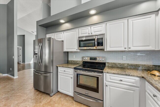 Building Photo - A vibrant 2-bedroom, 2-bathroom tropical retreat designed for both high-energy entertaining and l...
