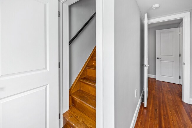Stairs to third floor loft / storage area - 733 E Elm St