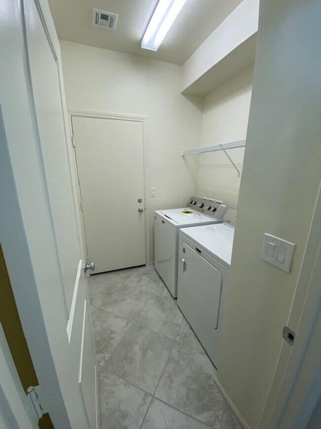 Building Photo - Beautiful Townhome in a Gated Community with 2-Car Garage!!