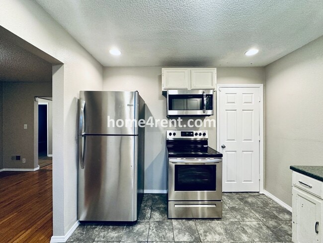 Building Photo - Adorable Home Featuring Wood Floors, SS Ap...