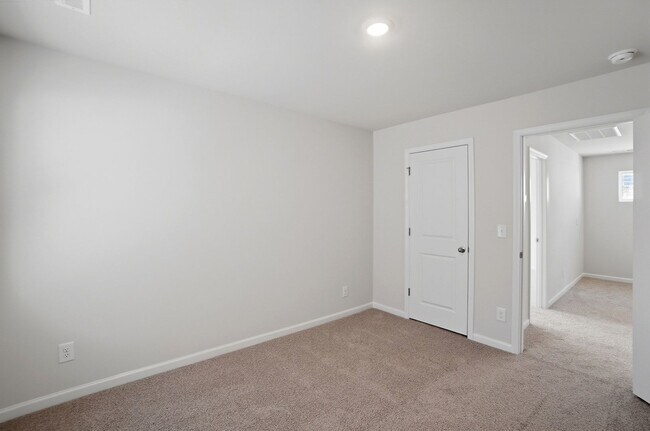 Building Photo - 4BR Home in The Pines at Paw Creek – New Construction + Private Deck