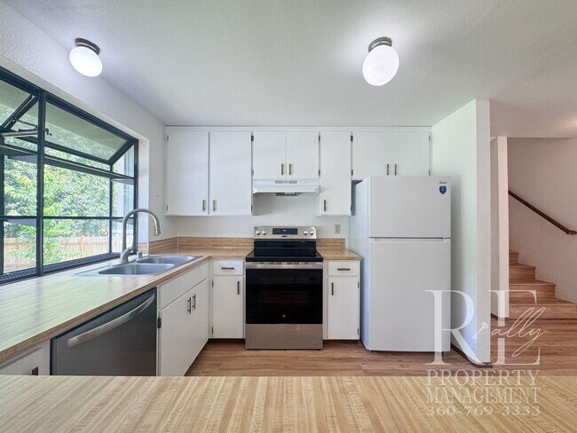 Building Photo - Spacious Poulsbo Home with Large Basement, Fenced Yard & Garden Space