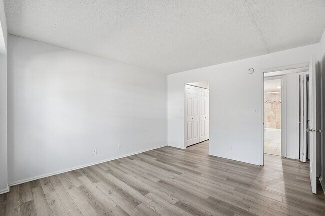 Building Photo - This expansive ground level residence is set within a serene, gated garden community surrounded b...