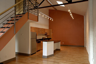 Soaring 22-foot-high loft ceilings. Maple flooring. - 511 W 4th St