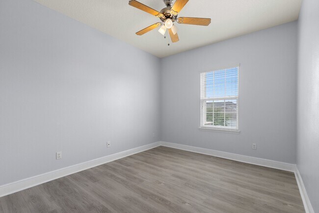 Building Photo - Spacious 6-Bedroom Home Near Lake Nona | 3-Car Garage + Tesla Charger